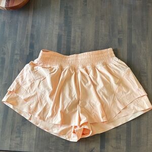 Lululemon shake it out high-rise running shorts 2.5 inch. Color Rock Melon